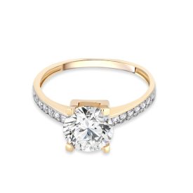   Sárga arany eljegyzési gyűrű középen egy nagy cirkónia kővel,  az oldalán apró fehér cirkónia kövekkel