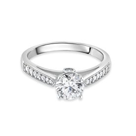   Fehérarany eljegyzési gyűrű közepén négy karmos fehér cirkónia kővel,  két szélén apróbb fehér cirkónia kövekkel